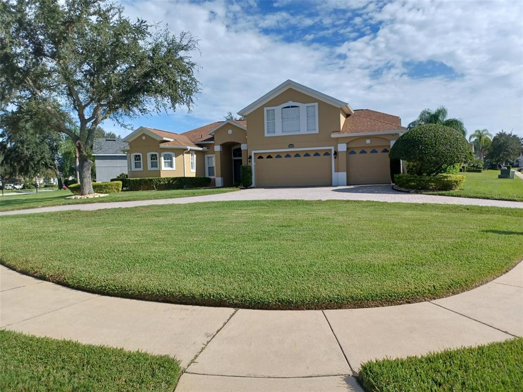 a front view of a house with a yard