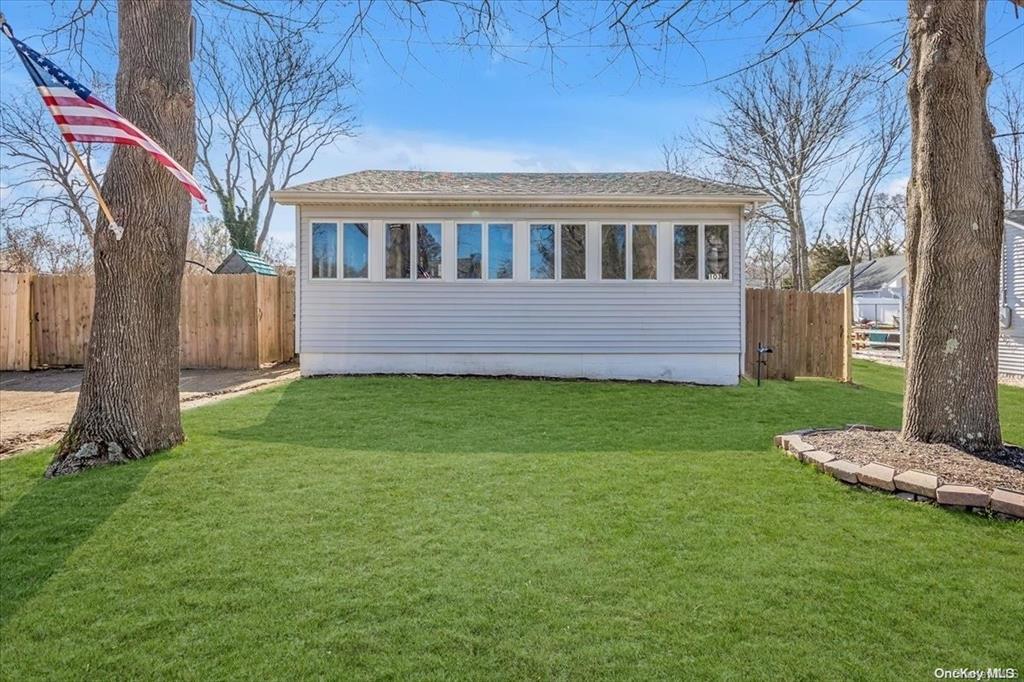 Front view of house featuring a yard