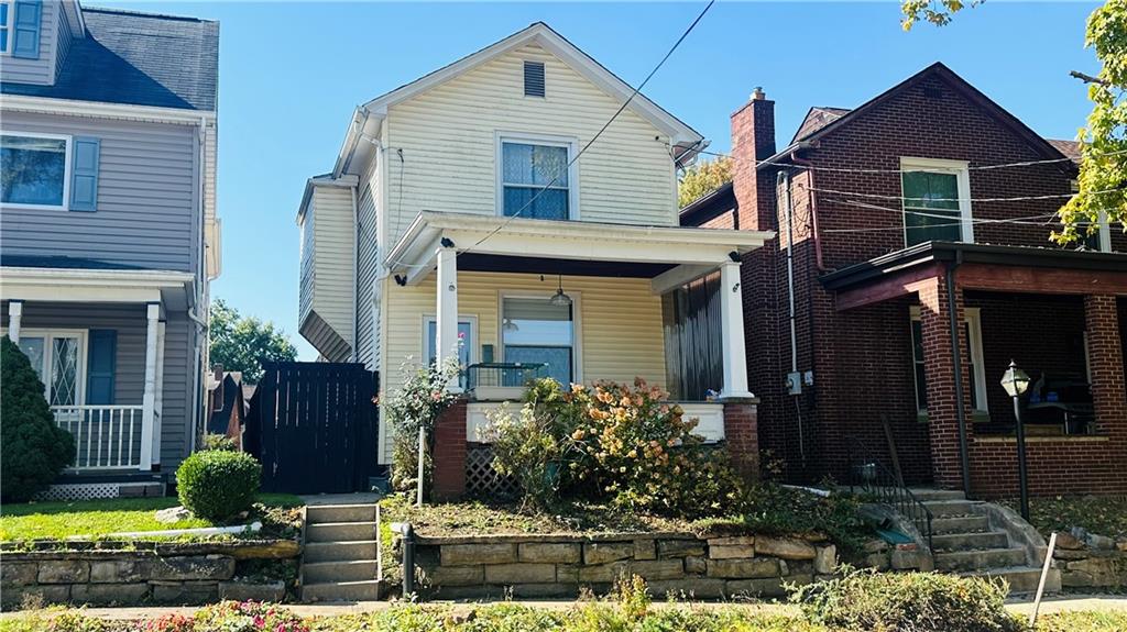 a front view of a house with garden