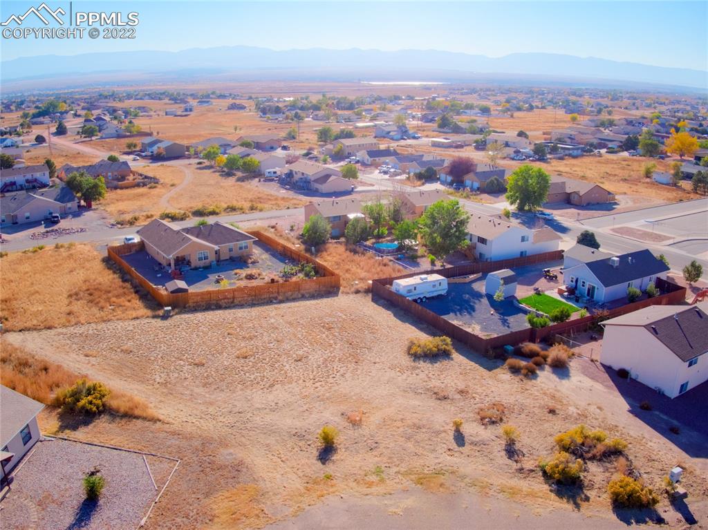 an aerial view of a house with a garden