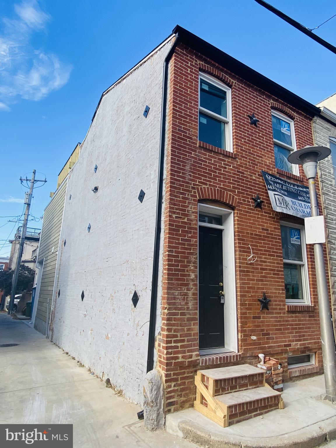 a front view of a house with stairs