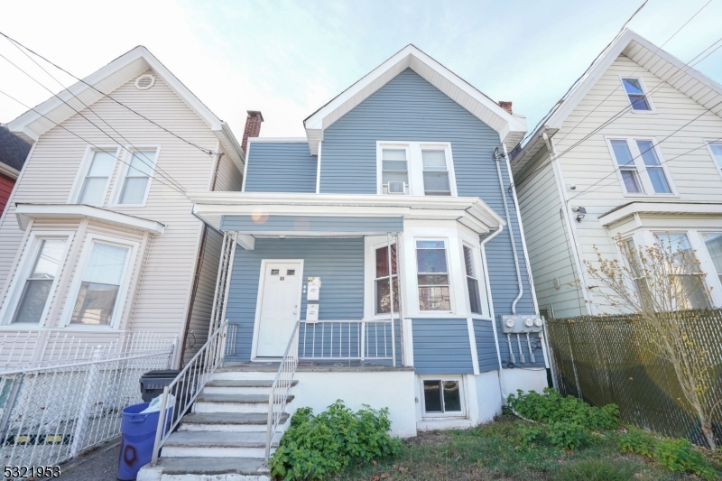 front view of a house with a small yard