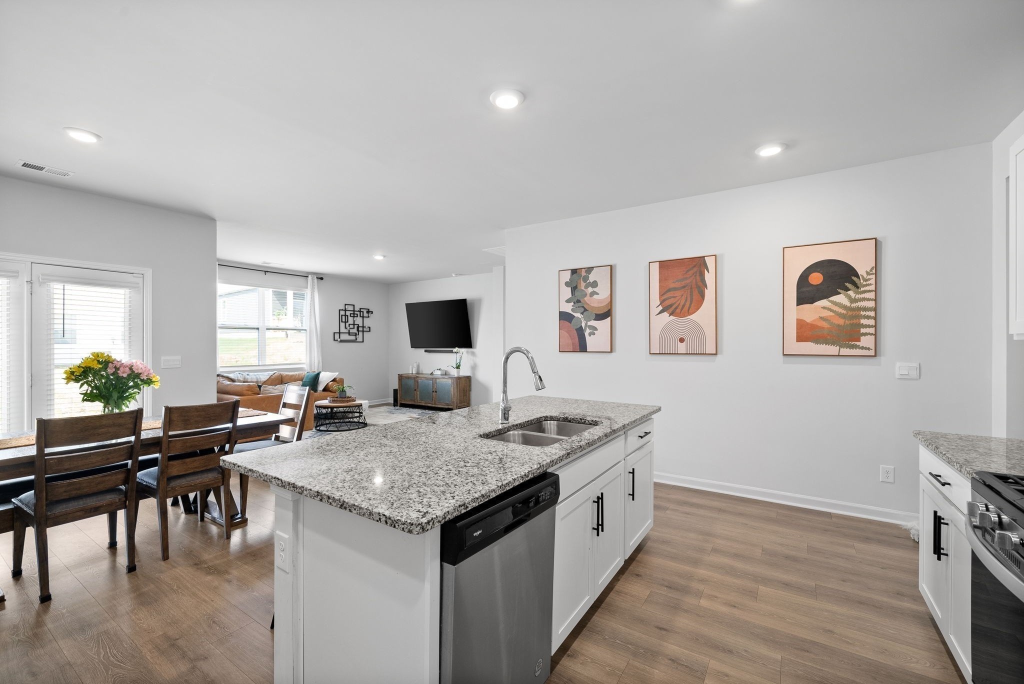 a view of a kitchen counter top space and living room