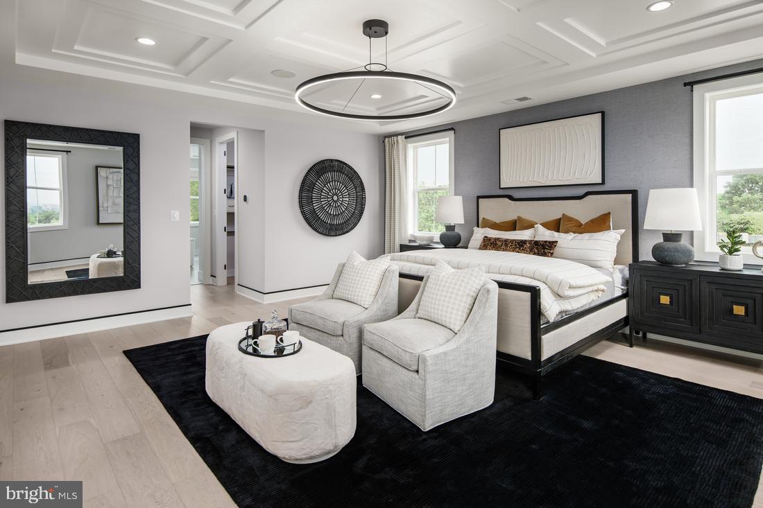 a living room with furniture and a clock