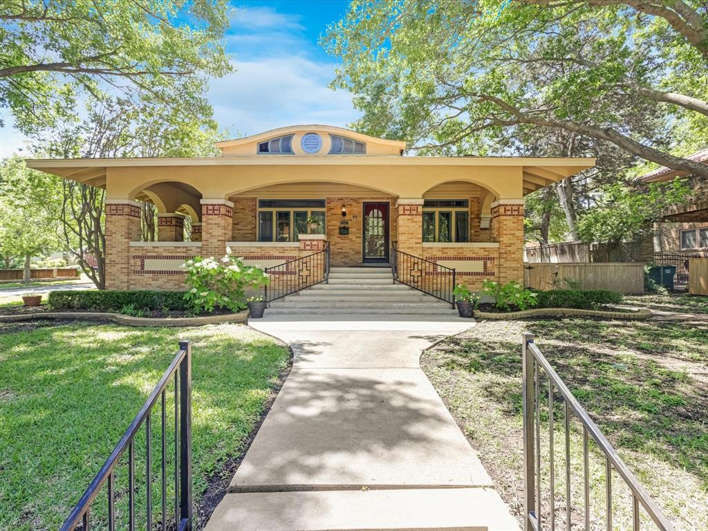 a front view of a house with yard