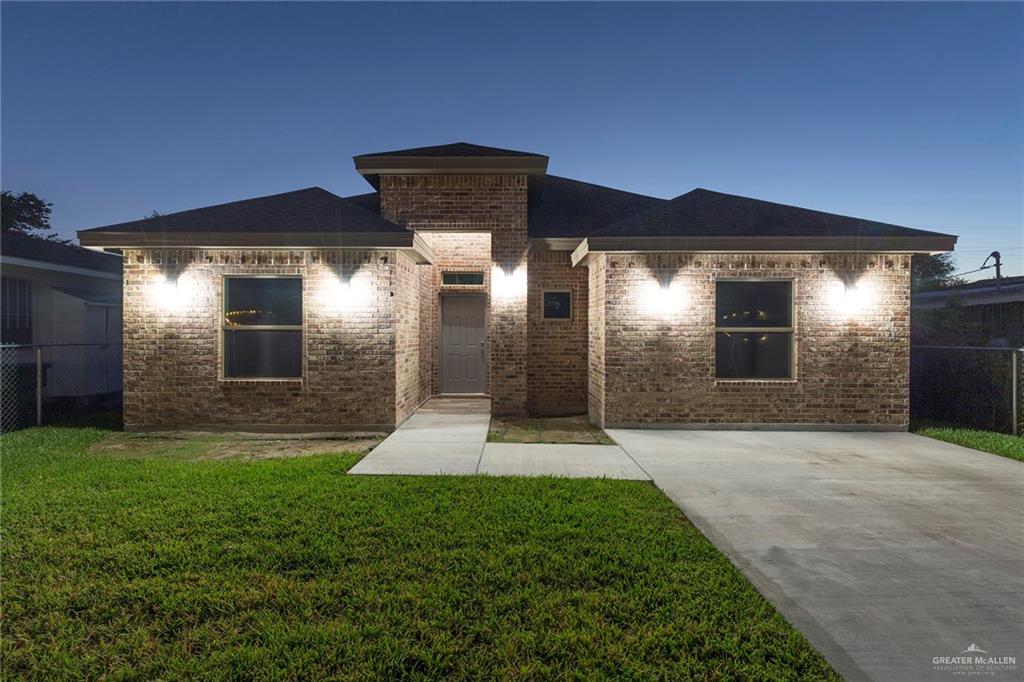 View of front of home with a pretty green lawn ready for accenting!