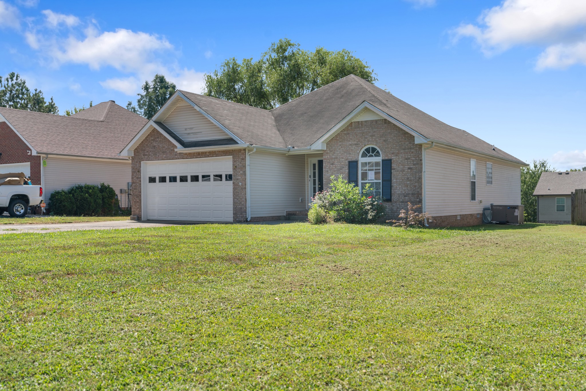 a front view of a house with garden