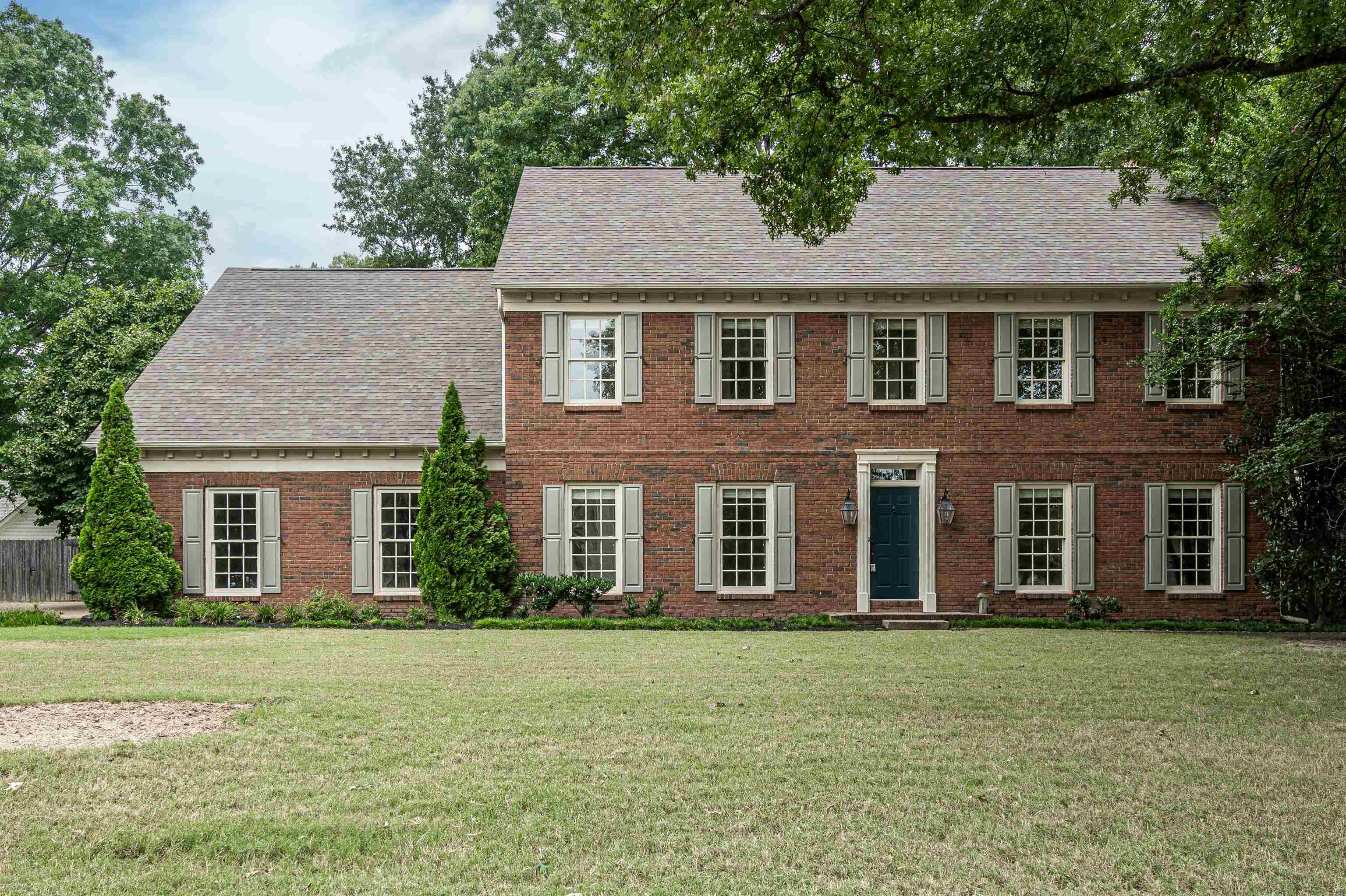 front view of a house with a yard