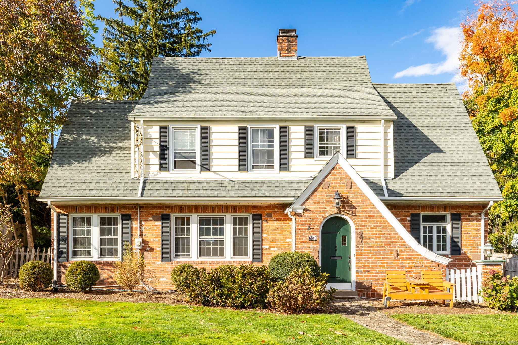 a view of a house with garden and yard