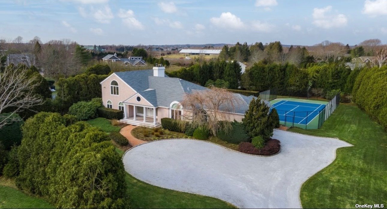 an aerial view of a house with a garden