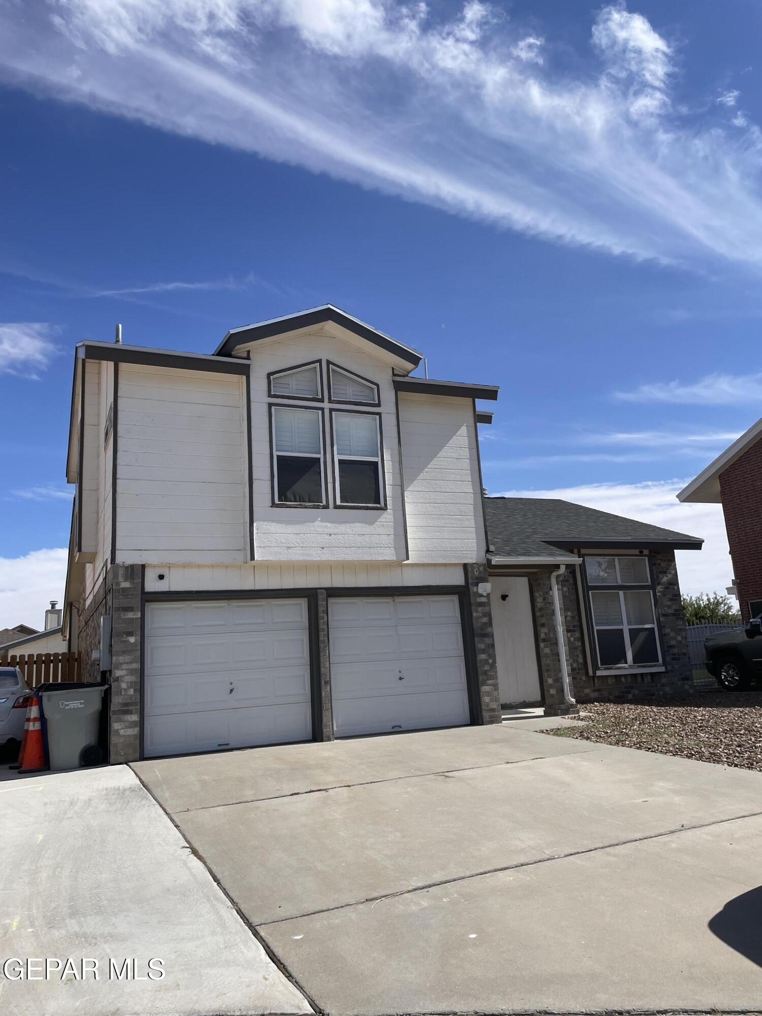 a front view of a house with a garage