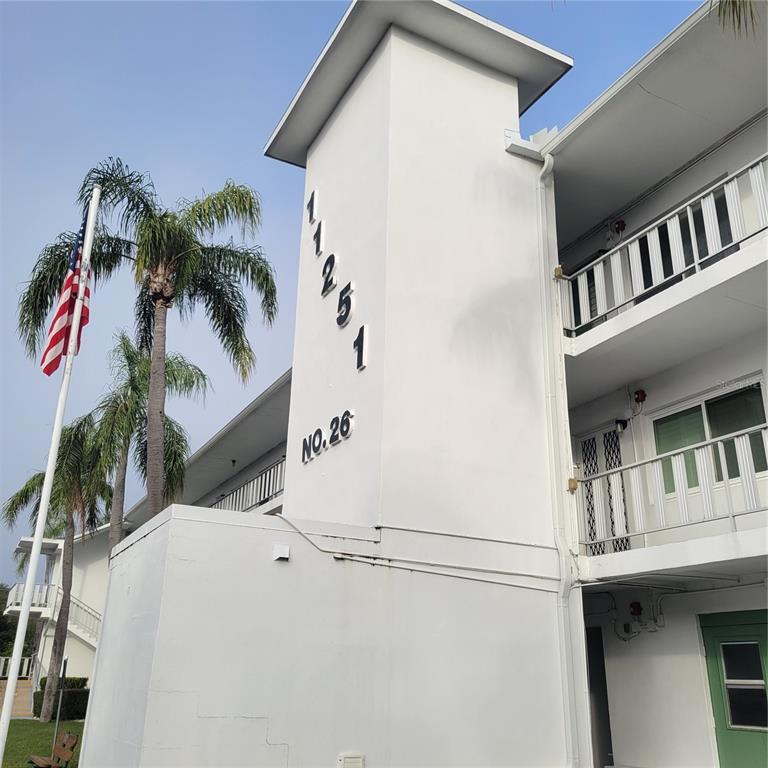 a view of balcony with a potted plant