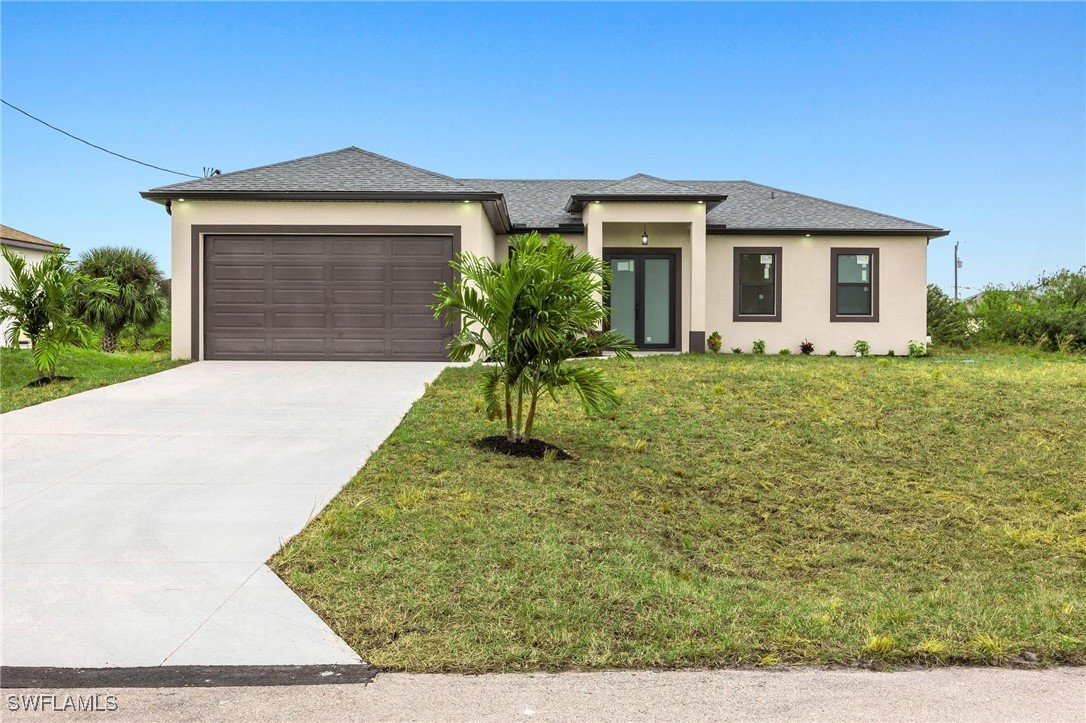 a front view of a house with a yard