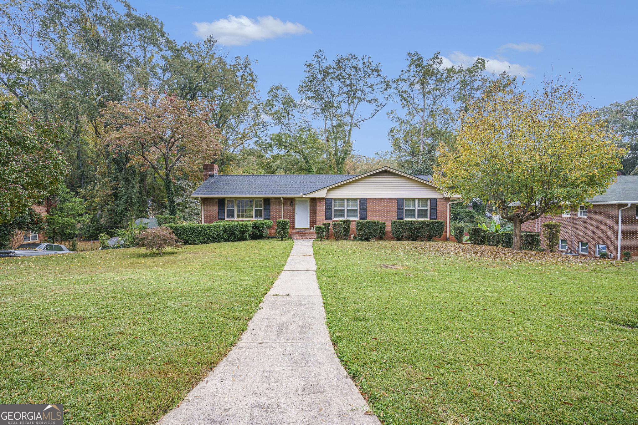 a front view of a house with yard