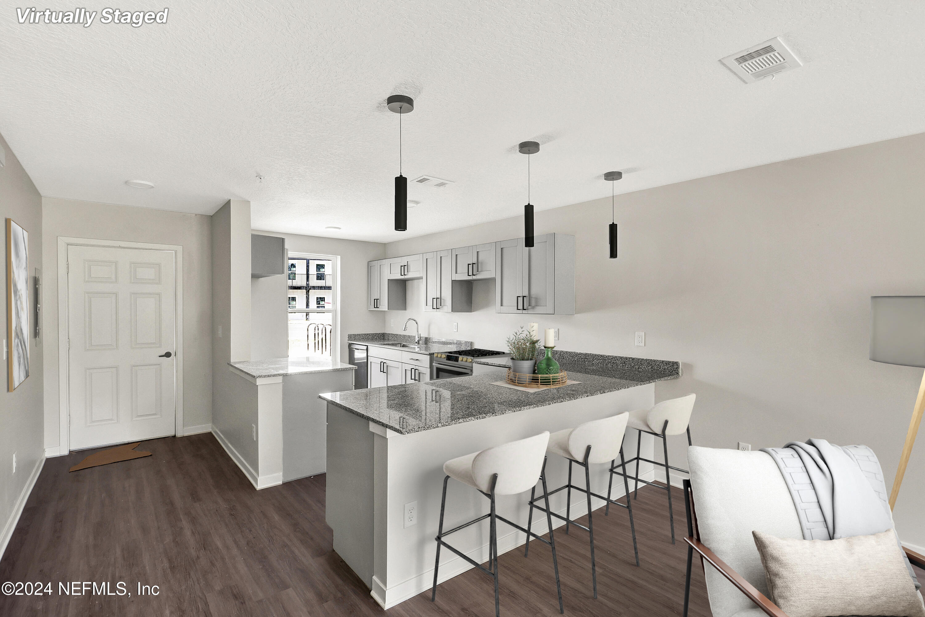 a kitchen with stainless steel appliances granite countertop a sink and cabinets