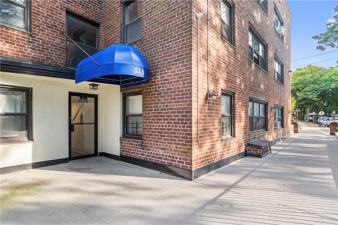 a view of a building with brick walls