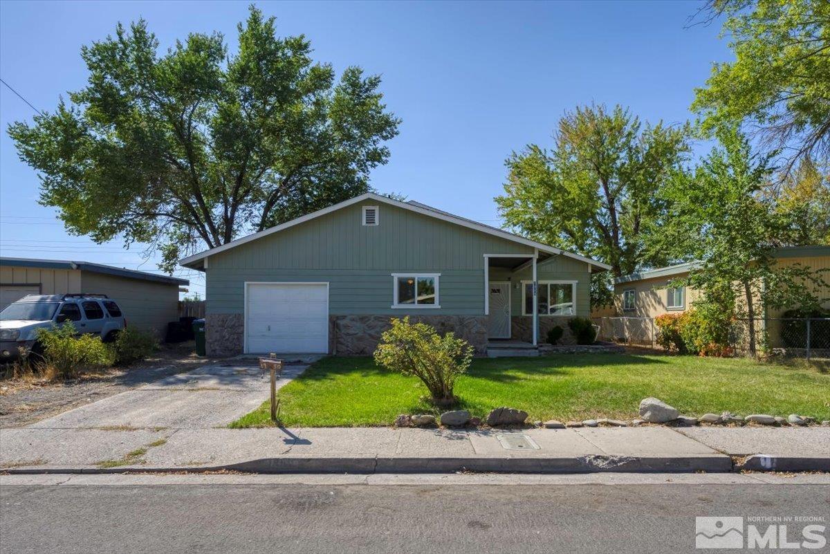 a house that has a tree in front of it