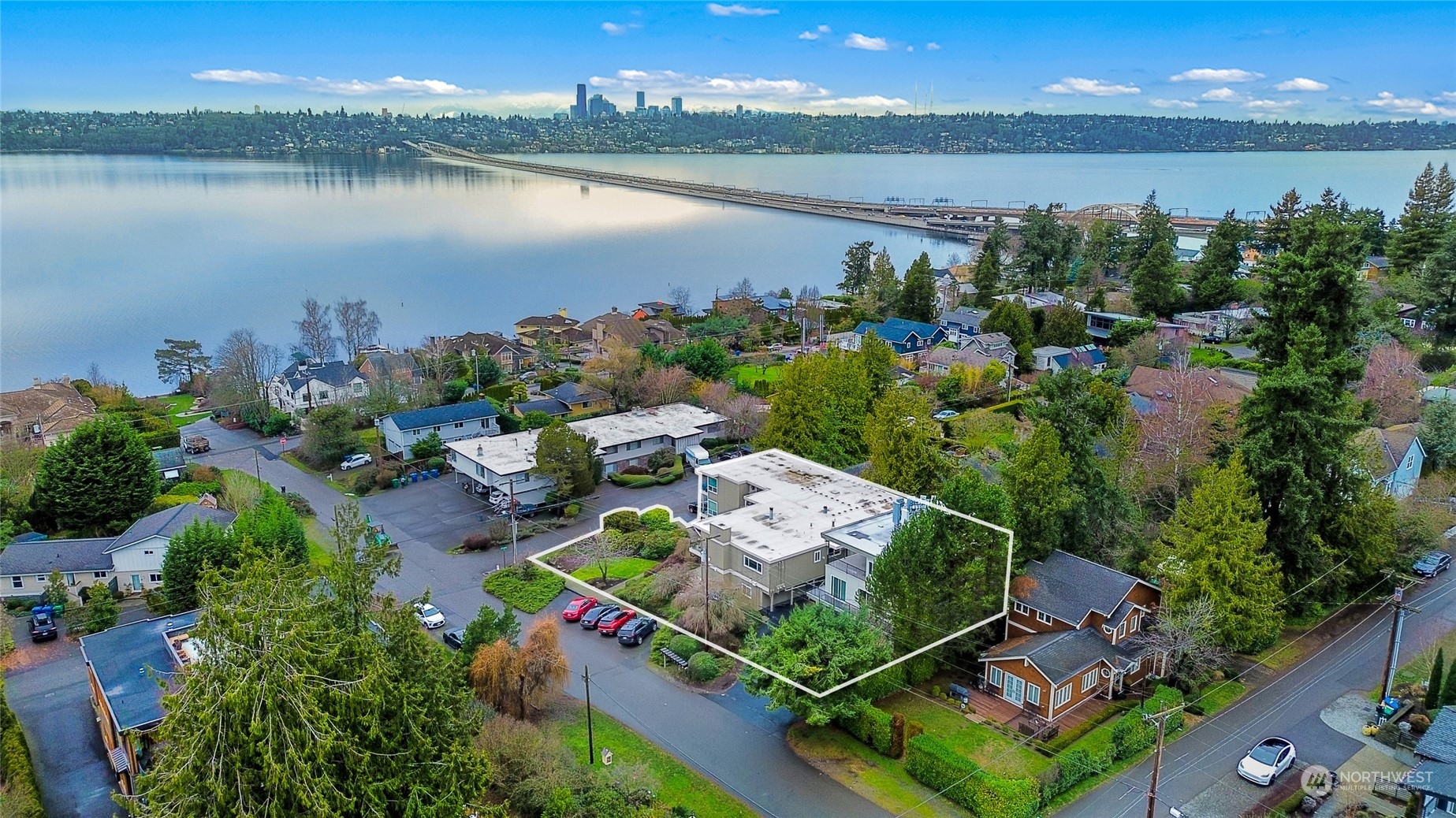 an aerial view of house with yard and lake view