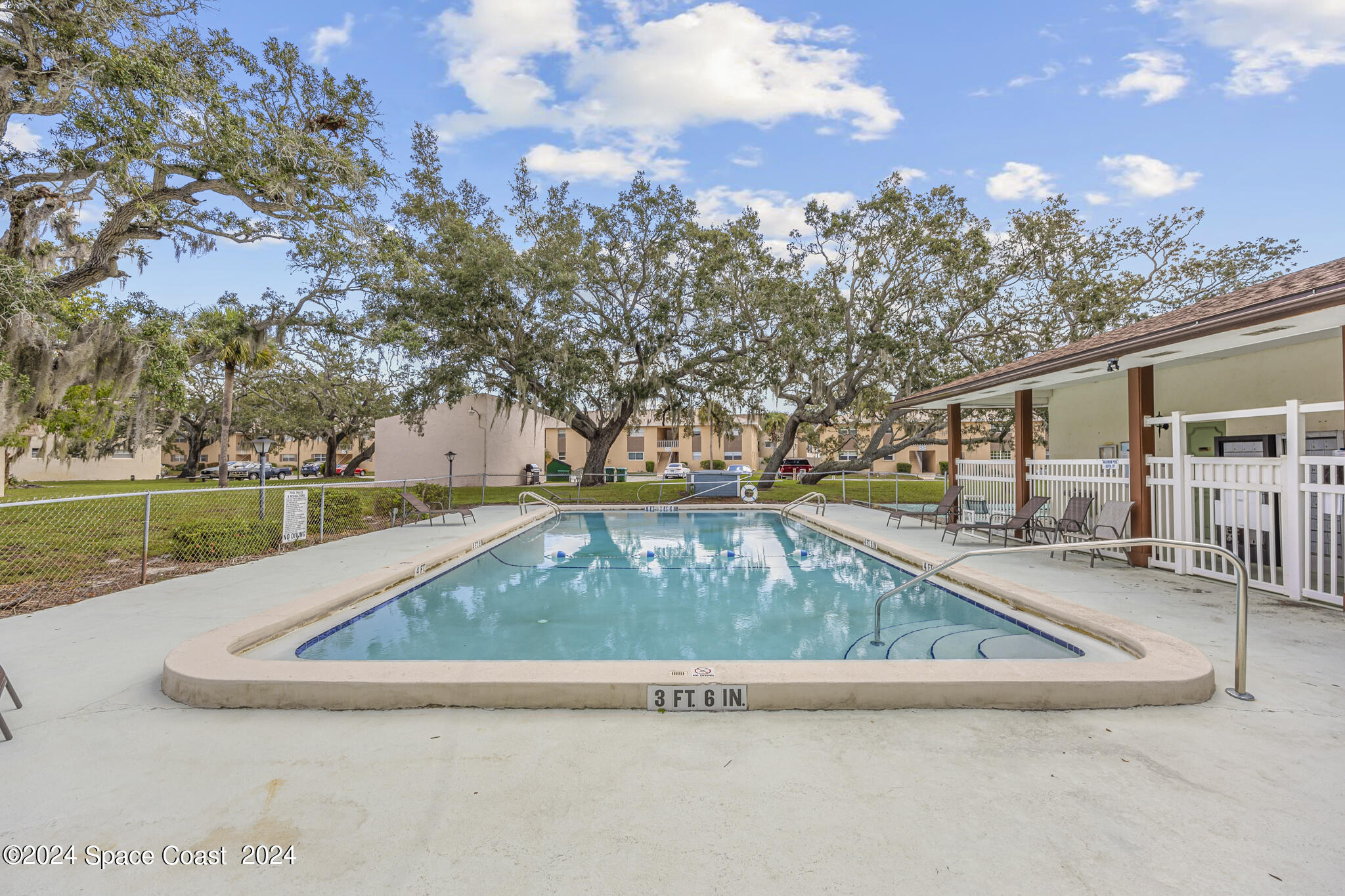 a view of swimming pool with a yard