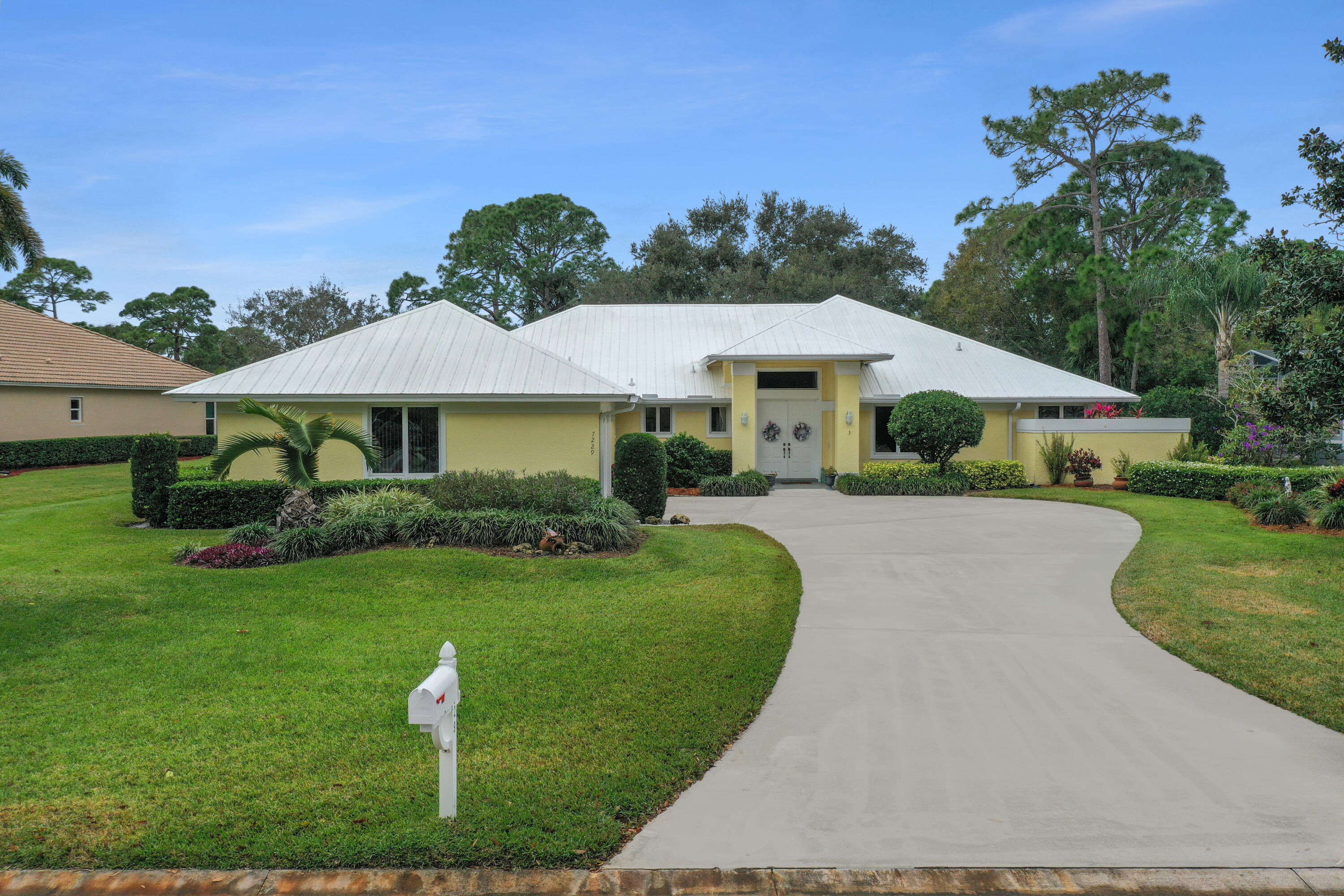 a front view of a house with garden