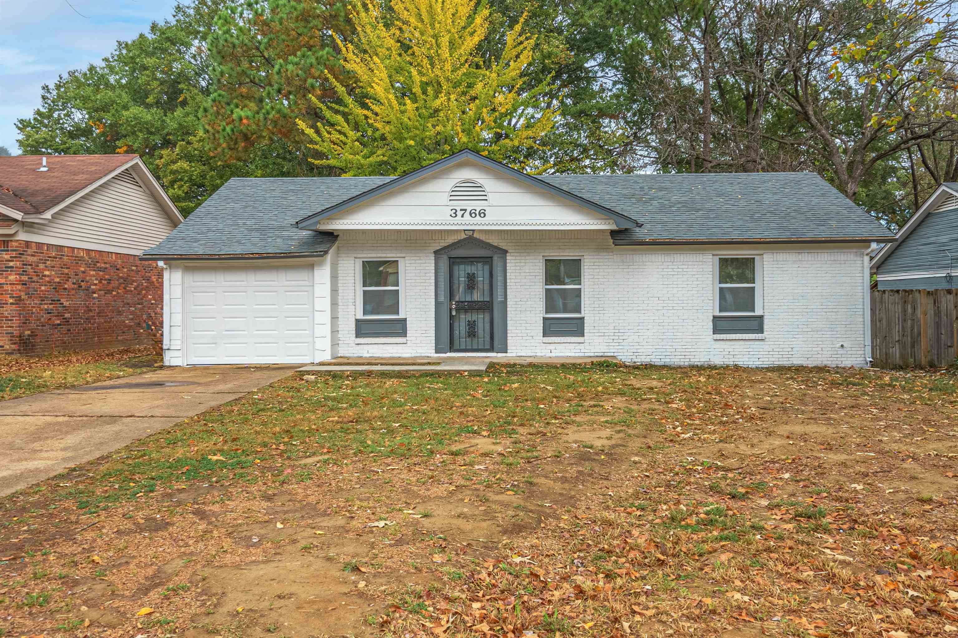 View of front of property featuring a garage