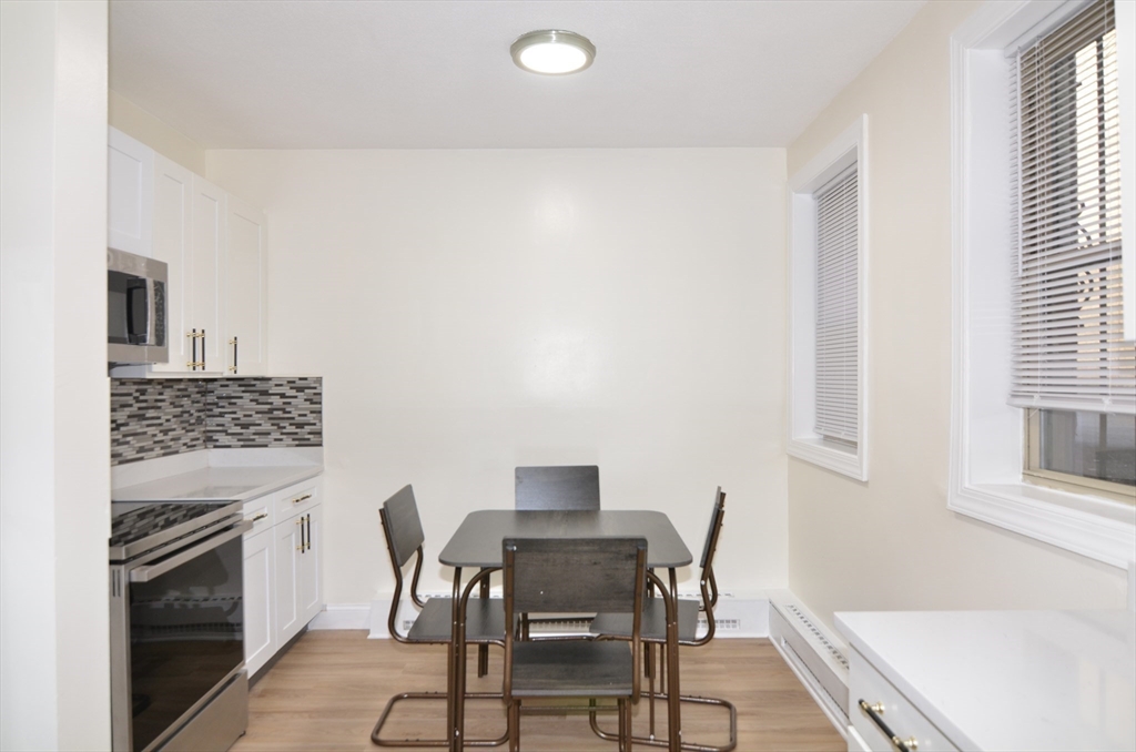 a dining room with furniture and a fireplace