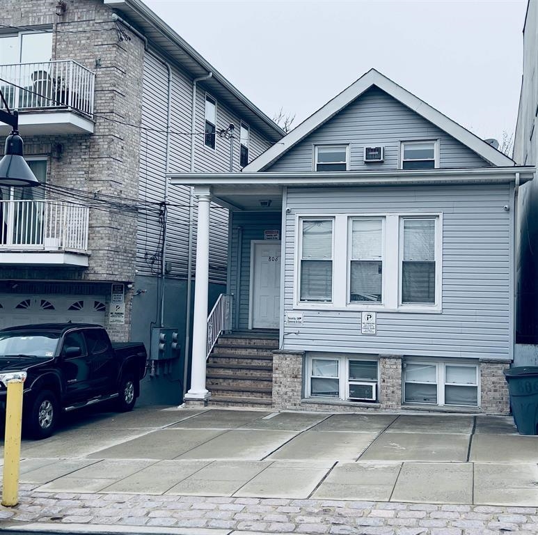 a front view of a house with a garage