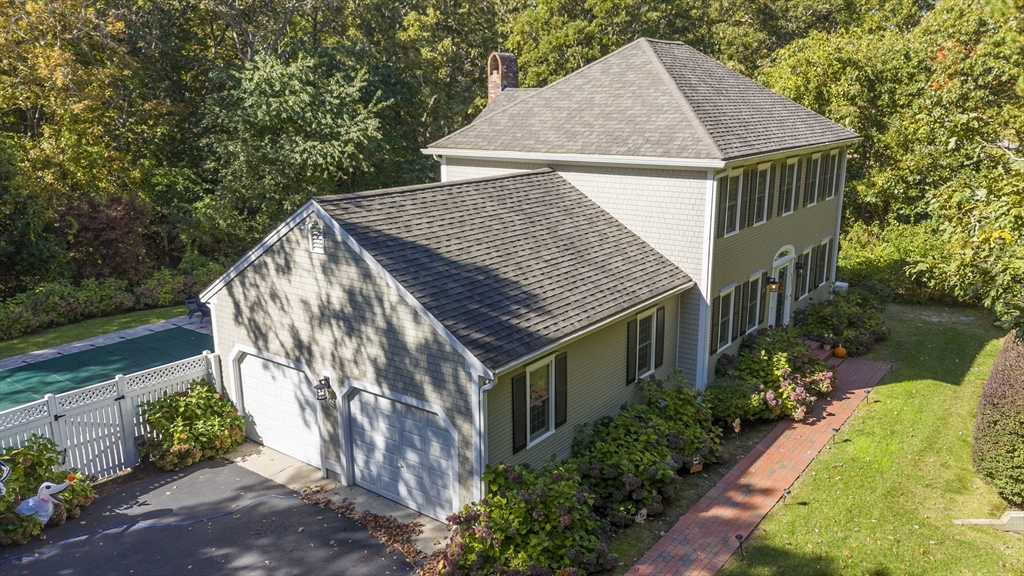 a aerial view of a house with a yard