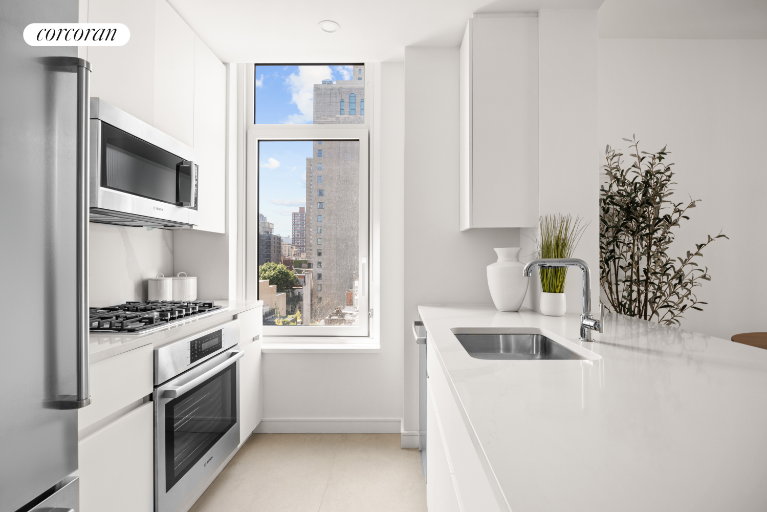 a kitchen with a white stove top oven and sink