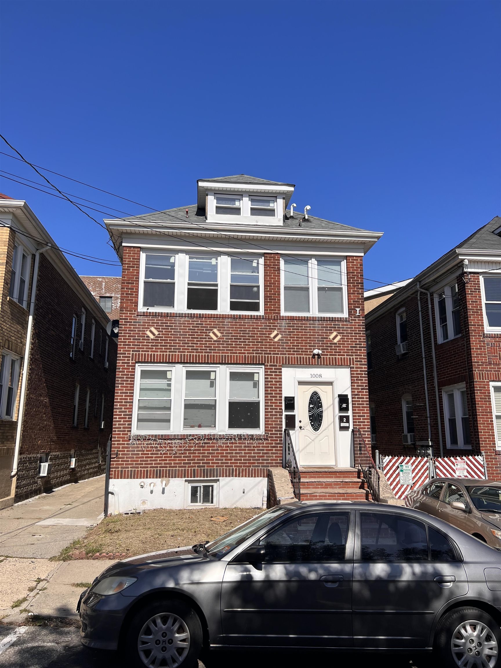 a front view of a house with parking space