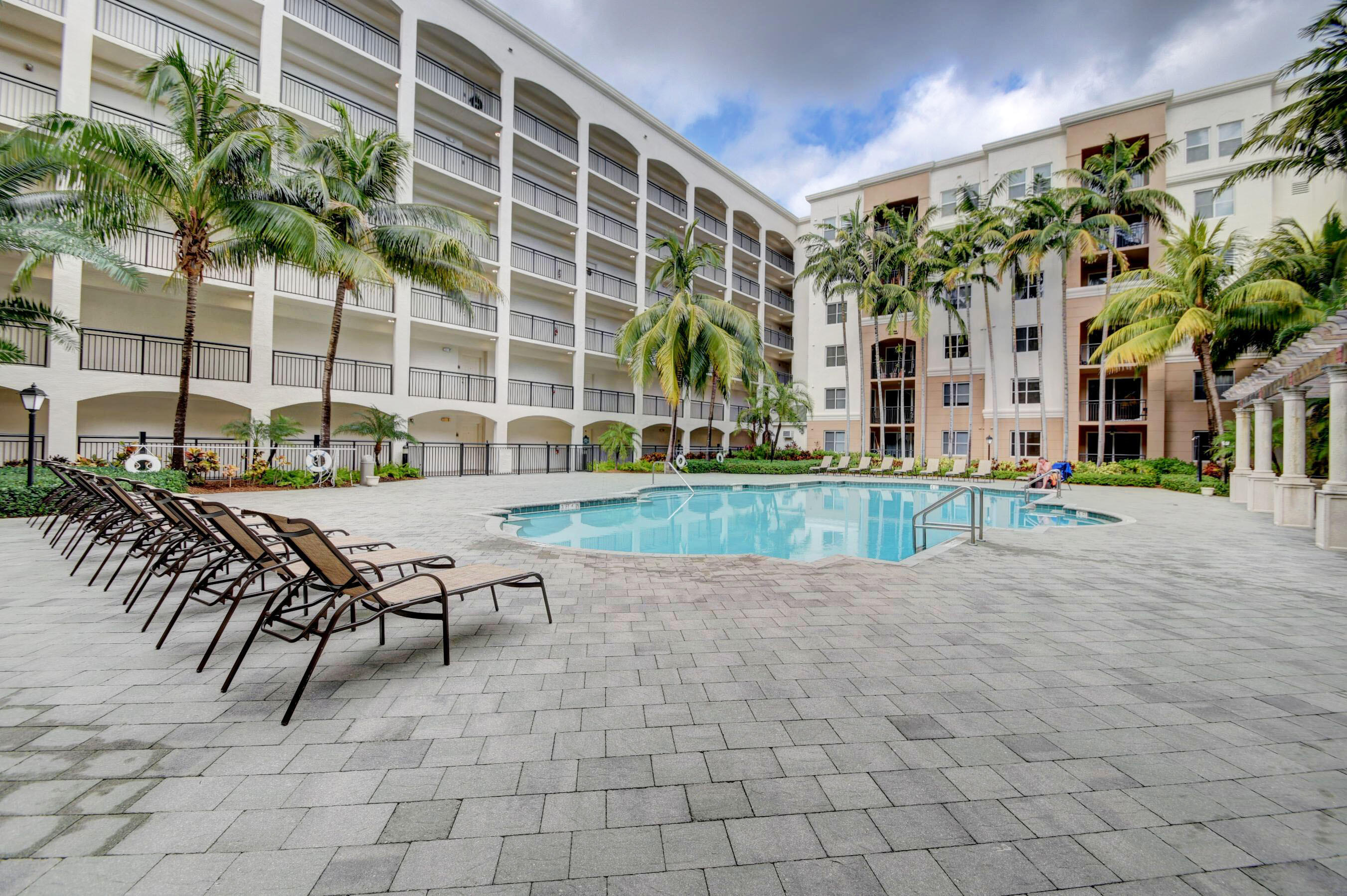 a view of a swimming pool with chairs