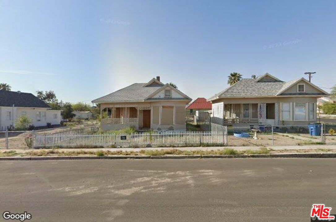 a front view of a house with a ocean view