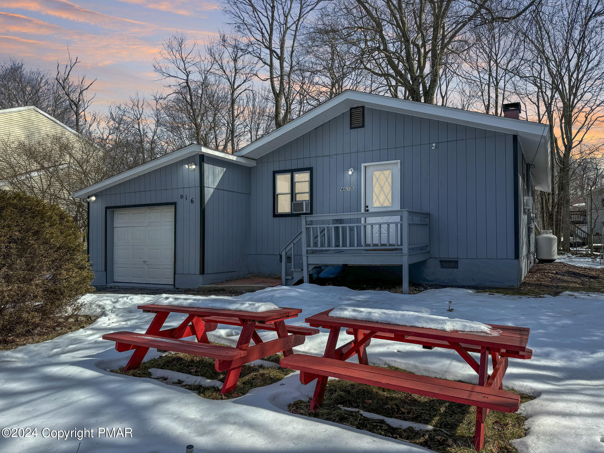 a backyard of a house with dishwasher and outdoor seating