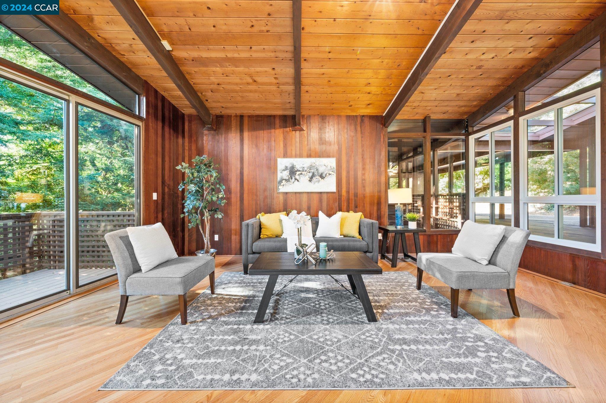 a outdoor living space with furniture and a rug