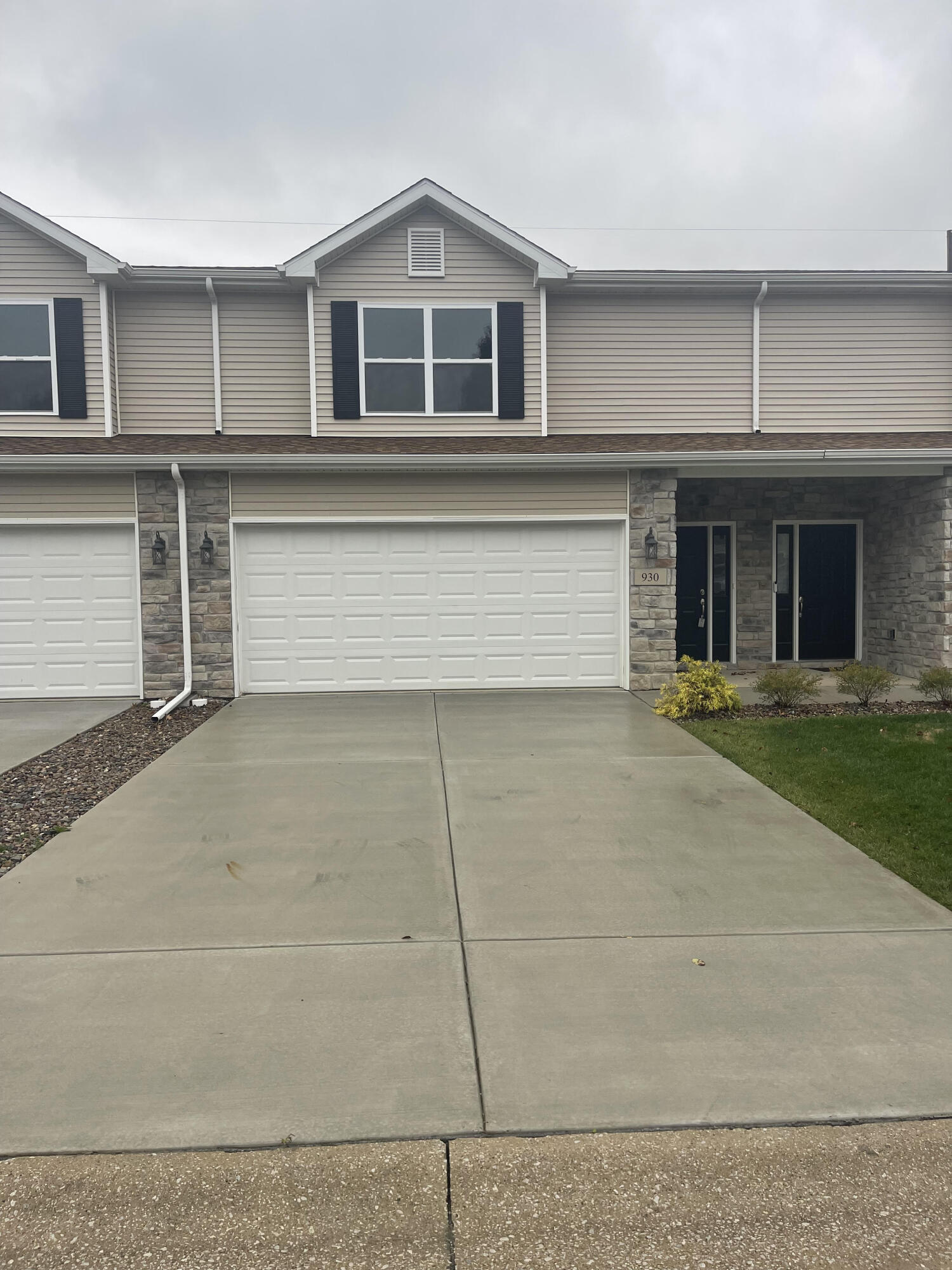 a view of a house with garage and windows