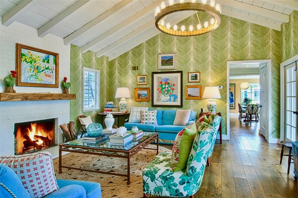 a living room with furniture a rug and a fireplace