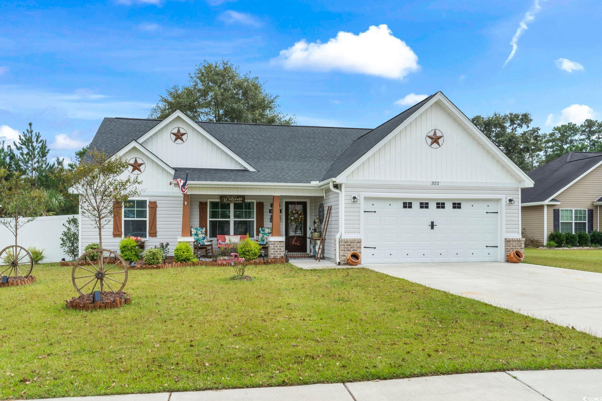 View of front of property featuring a front lawn,