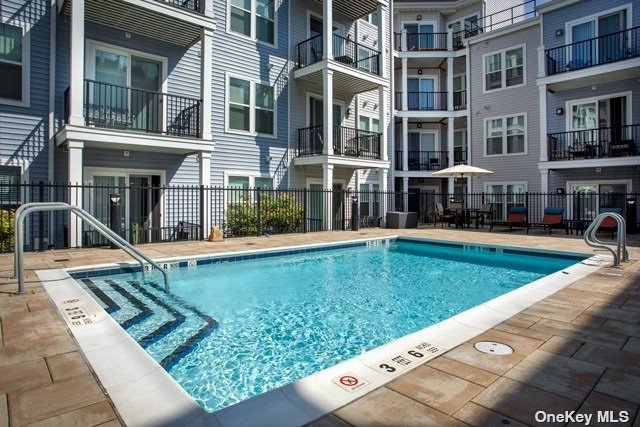 a view of a building with a swimming pool