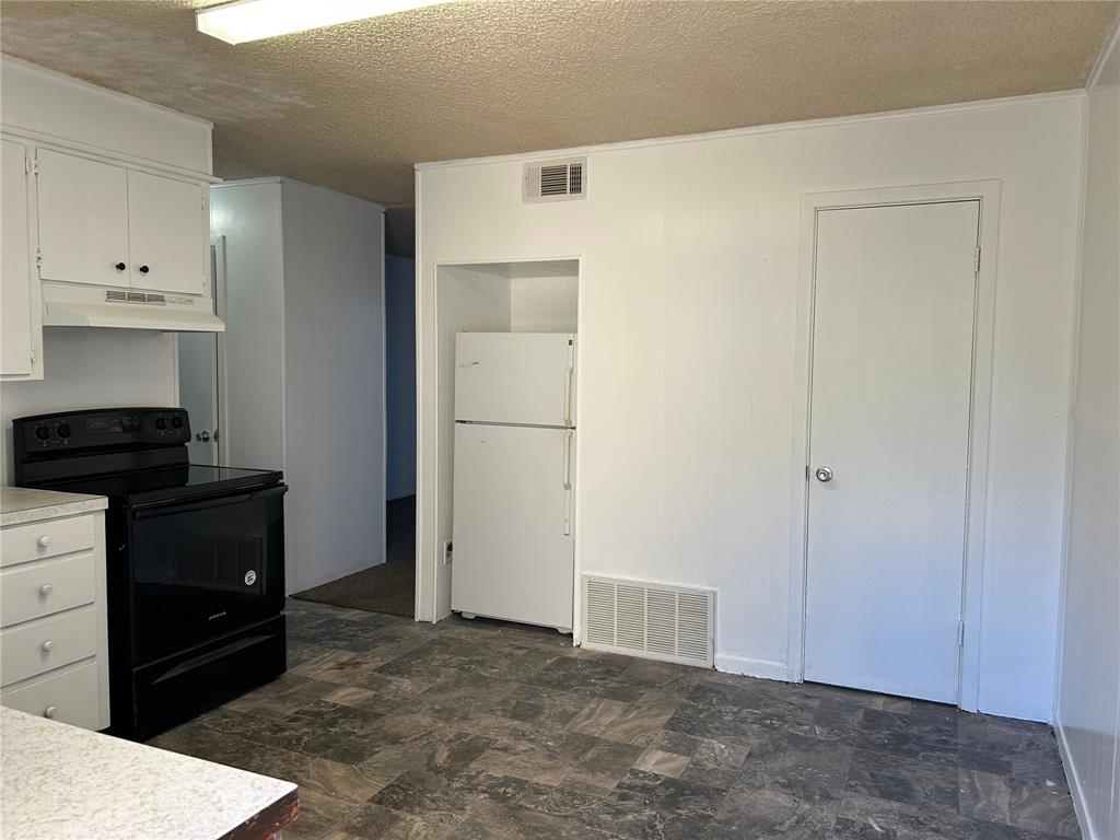 a view of a closet in kitchen