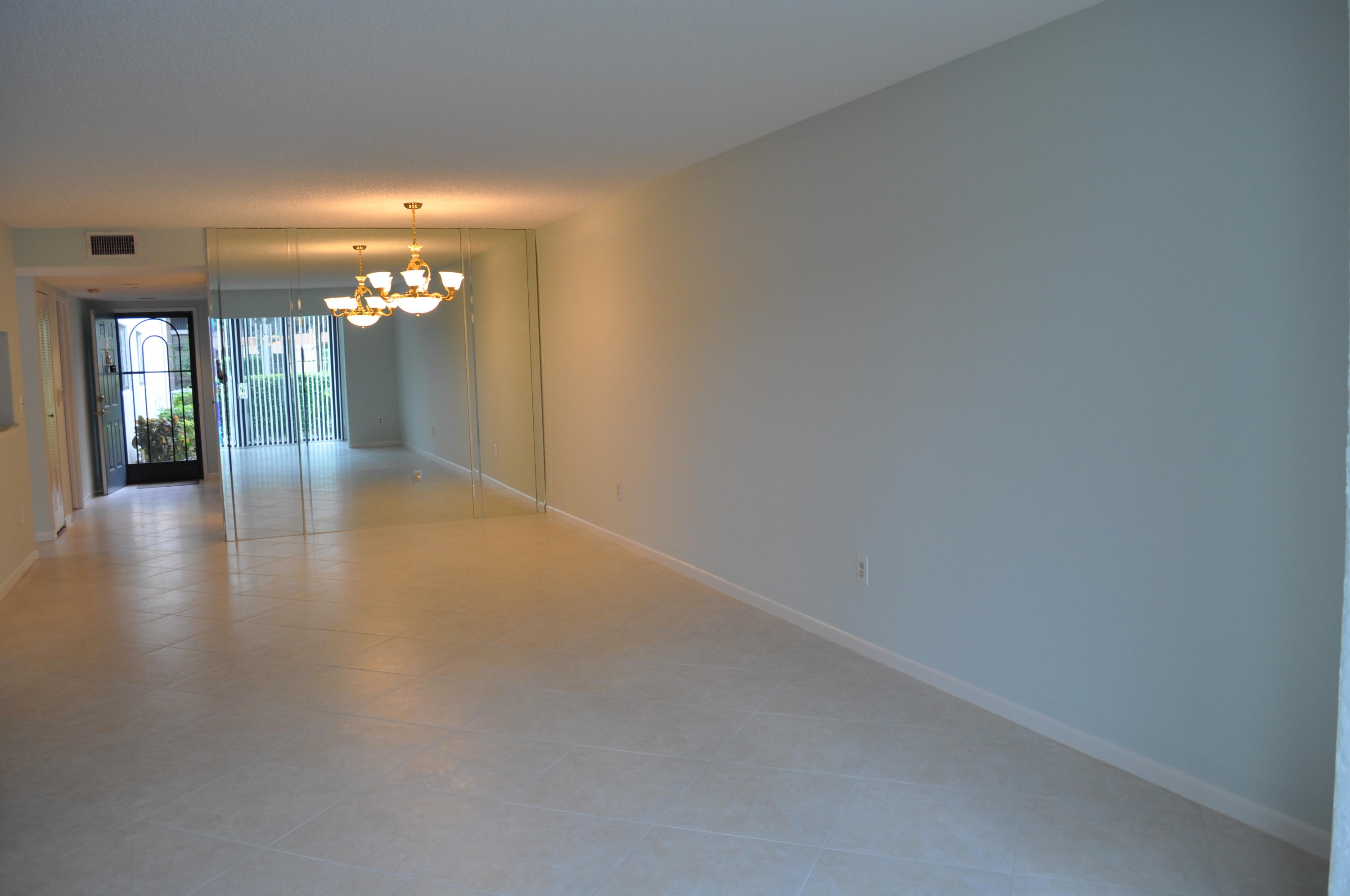 a view of livingroom and hallway with wooden floor