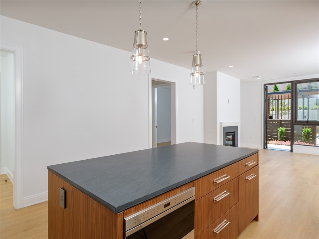 a view of kitchen island with wooden floor