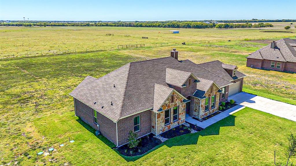 a aerial view of a house with a ocean view