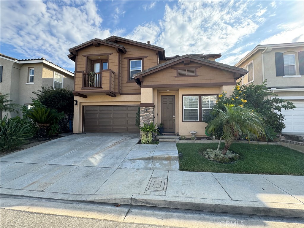 a front view of a house with yard