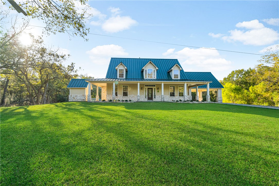 View of front of property featuring a porch and a