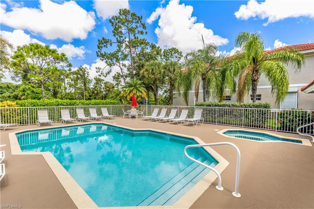 a view of a swimming pool with a lounge chairs