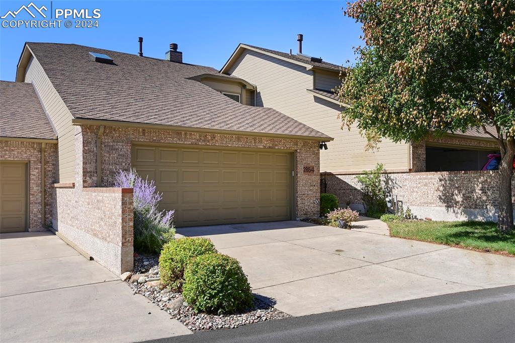 a front view of a house with a garage