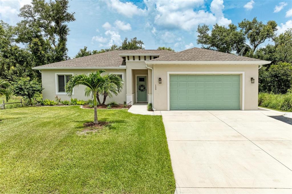 a front view of a house with garden