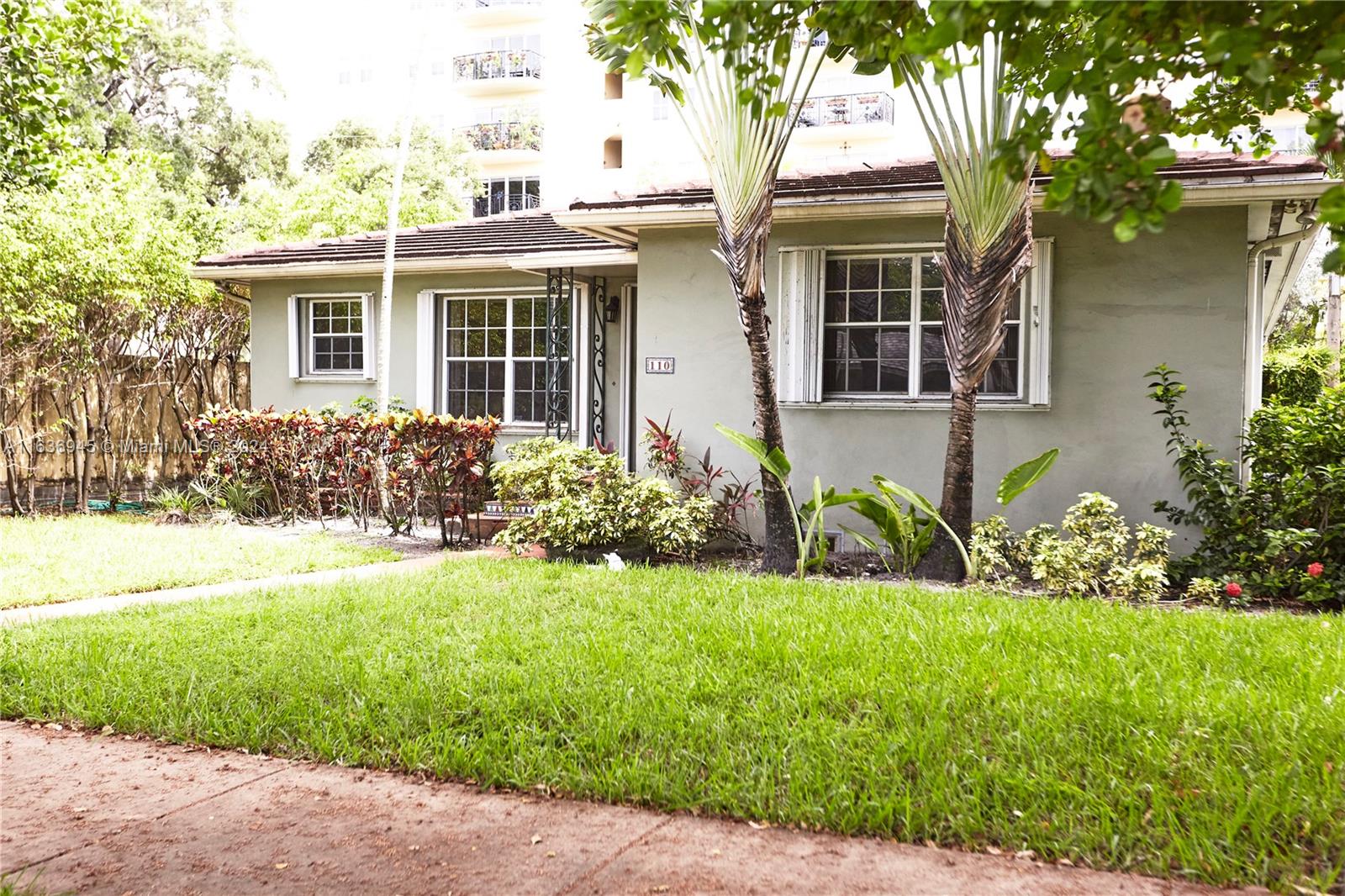 front view of a house with a yard