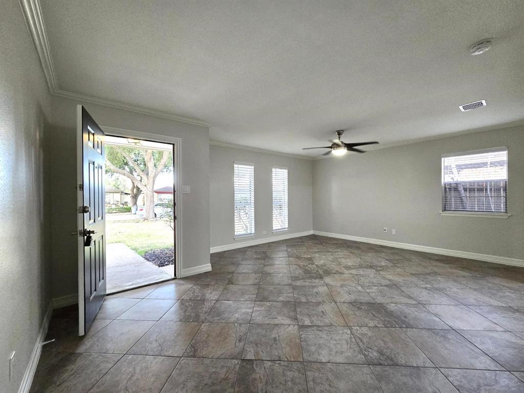 a view of an empty room and window