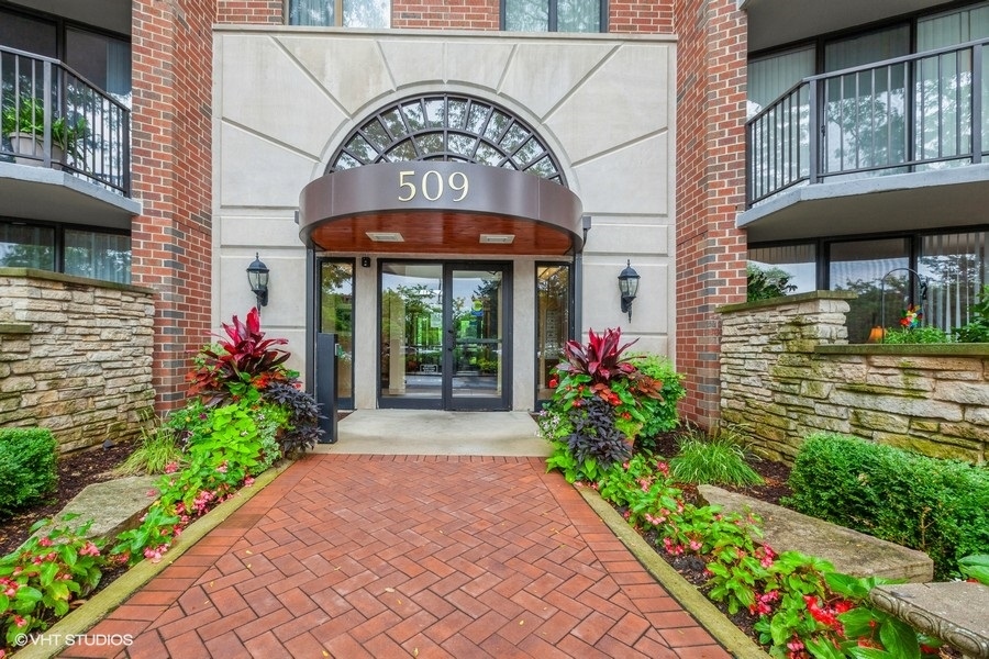 a flower garden is sitting in front of door